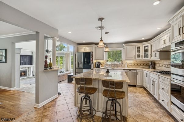 Fireplace, Interior, Kitchen, Pendant Lights, Recessed Lighting, Stainless Steel Appliances, Wood Texture Flooring