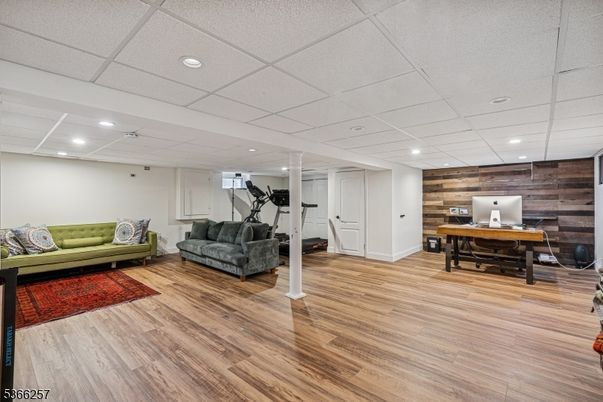 Fitness Equipment, Home Office, Interior, Recessed Lighting, Wood Texture Flooring, Wooden Walls