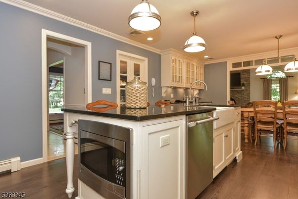 Dining room, Interior, Kitchen, Pendant Lights, Recessed Lighting, Stainless Steel Appliances, Wood Texture Flooring