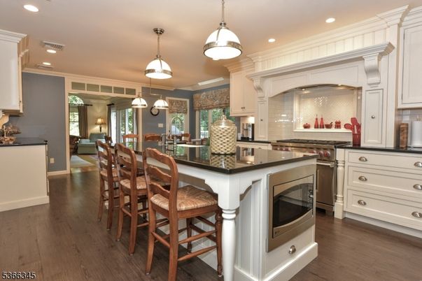 Dining room, Interior, Kitchen, Pendant Lights, Recessed Lighting, Stainless Steel Appliances, Wood Texture Flooring