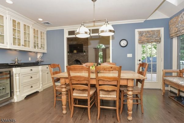 Dining room, Fireplace, Interior, Pendant Lights, Recessed Lighting, Stone Walls, Wood Texture Flooring