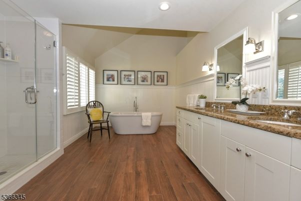 Bathroom, Dual Sink Vanities, Free Standing Baths, Glass Shower, Interior, Recessed Lighting, Wood Texture Flooring