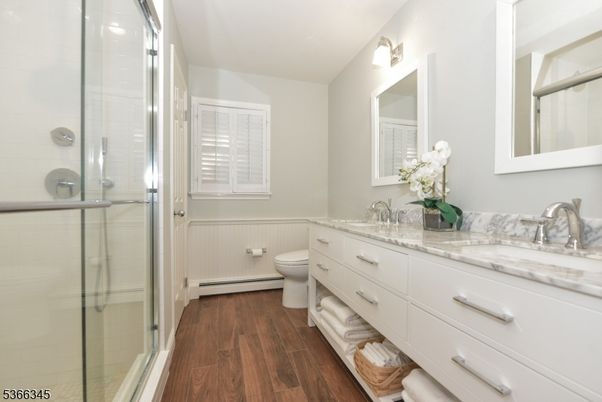 Bathroom, Dual Sink Vanities, Glass Shower, Interior, Wood Texture Flooring