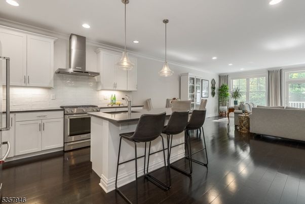 Dining room, Interior, Kitchen, Living room, Pendant Lights, Recessed Lighting, Stainless Steel Appliances, Wood Texture Flooring