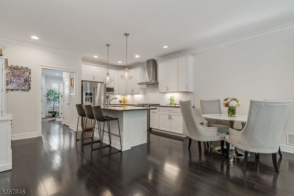 Dining room, Interior, Kitchen, Pendant Lights, Recessed Lighting, Stainless Steel Appliances, Wood Texture Flooring