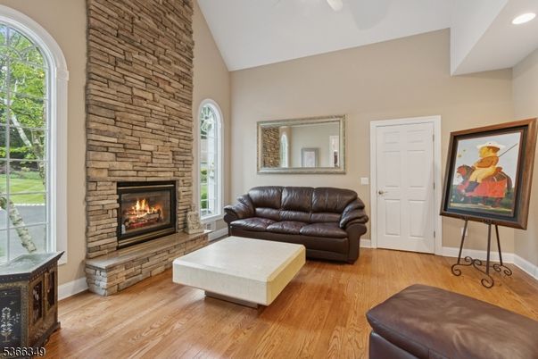 Fireplace, Interior, Living room, Recessed Lighting, Stone Walls, Wood Texture Flooring