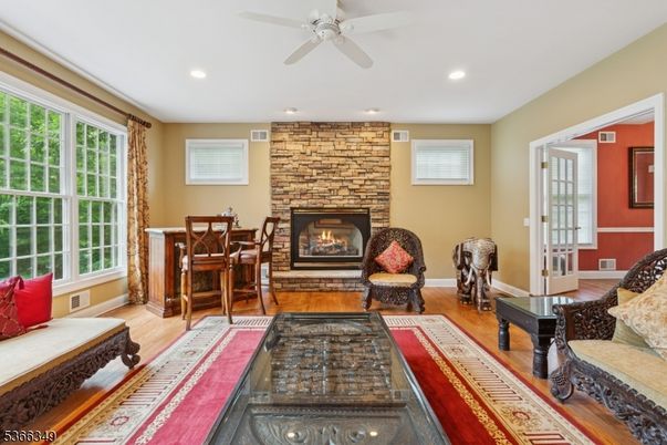 Fireplace, Interior, Living room, Recessed Lighting, Stone Walls, Wood Texture Flooring