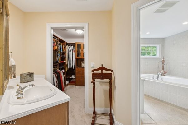 Bathroom, Dual Sink Vanities, Interior, Recessed Lighting, Walk-in Closets