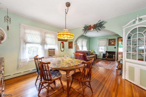Dining room, Fireplace, Interior, Pendant Lights, Wood Texture Flooring