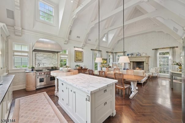 Dining room, Fireplace, Interior, Kitchen, Living room, Pendant Lights, Stainless Steel Appliances, Wood Texture Flooring