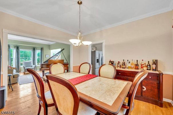 Dining room, Interior, Pendant Lights, Piano, Wood Texture Flooring