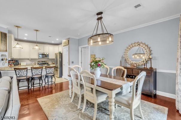 Dining room, Interior, Kitchen, Pendant Lights, Recessed Lighting, Stainless Steel Appliances, Wood Texture Flooring