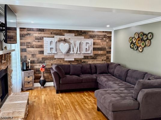 Fireplace, Interior, Living room, Recessed Lighting, Stone Walls, Wood Texture Flooring, Wooden Walls