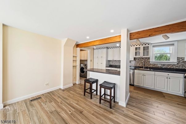 Interior, Kitchen, Recessed Lighting, Washer, Wood Texture Flooring