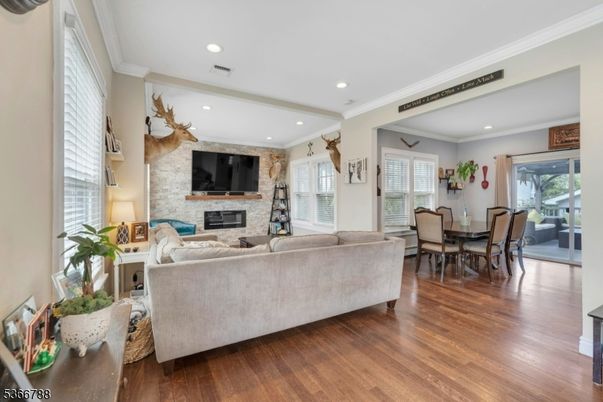 Dining room, Fireplace, Interior, Living room, Recessed Lighting, Stone Walls, Wood Texture Flooring