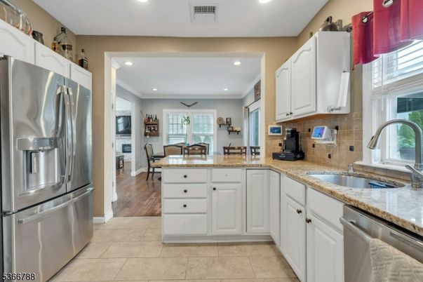 Dining room, Interior, Kitchen, Recessed Lighting, Stainless Steel Appliances, Wood Texture Flooring