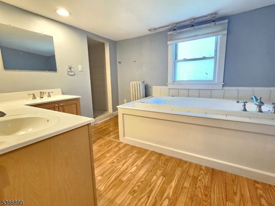Bathroom, Dual Sink Vanities, Interior, Recessed Lighting, Wood Texture Flooring