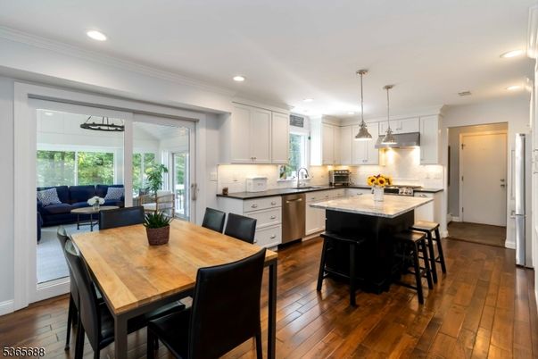 Dining room, Interior, Kitchen, Living room, Pendant Lights, Recessed Lighting, Stainless Steel Appliances, Wood Texture Flooring