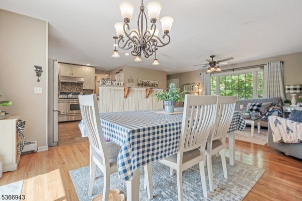 Chandelier, Dining room, Interior, Kitchen, Living room, Stainless Steel Appliances, Wood Texture Flooring