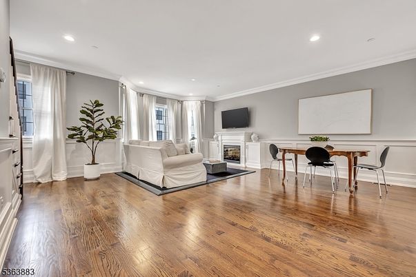 Dining room, Fireplace, Interior, Living room, Recessed Lighting, Wood Texture Flooring