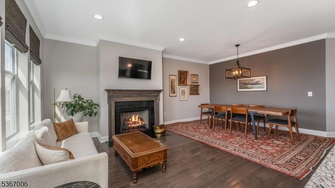 Dining room, Fireplace, Interior, Living room, Pendant Lights, Recessed Lighting, Wood Texture Flooring