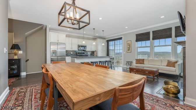 Dining room, Interior, Kitchen, Living room, Pendant Lights, Recessed Lighting, Stainless Steel Appliances, Wood Texture Flooring