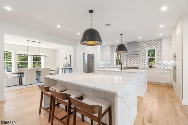 Dining room, Interior, Kitchen, Pendant Lights, Recessed Lighting, Stainless Steel Appliances, Wood Texture Flooring