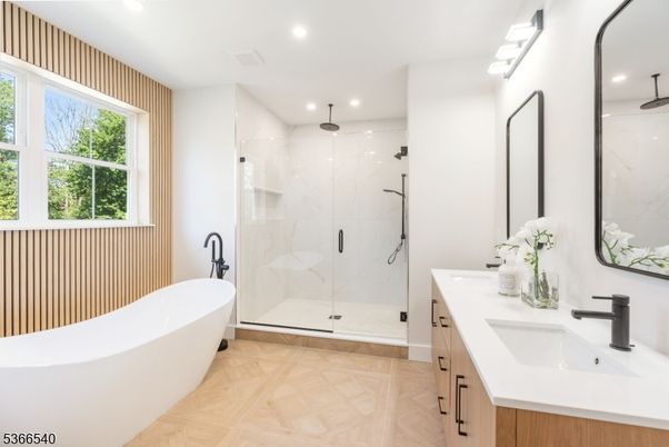 Bathroom, Dual Sink Vanities, Free Standing Baths, Glass Shower, Interior, Marble Walls, Recessed Lighting, Wood Texture Flooring