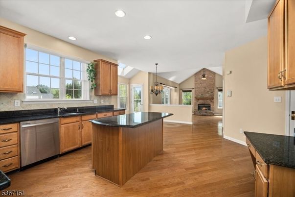 Chandelier, Fireplace, Interior, Kitchen, Pendant Lights, Recessed Lighting, Stone Walls, Wood Texture Flooring