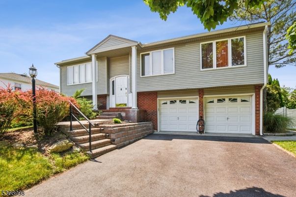 Attached, Exterior, Facade, Brick Facade, Raised Ranch