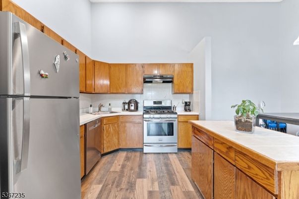 Interior, Kitchen, Stainless Steel Appliances, Tile Countertops, Wood Texture Flooring