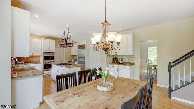 Chandelier, Dining room, Interior, Kitchen, Recessed Lighting, Stainless Steel Appliances, Wood Texture Flooring