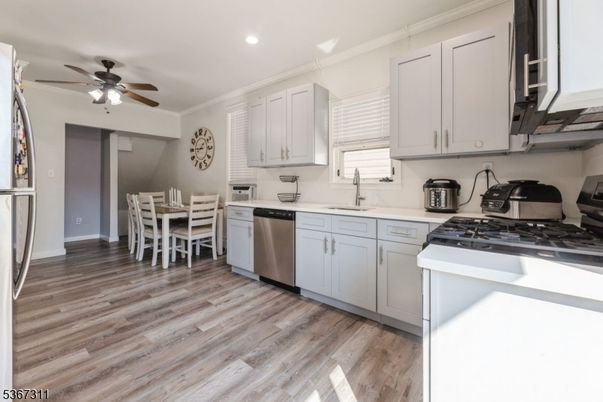 Dining room, Interior, Kitchen, Recessed Lighting, Stainless Steel Appliances, Wood Texture Flooring