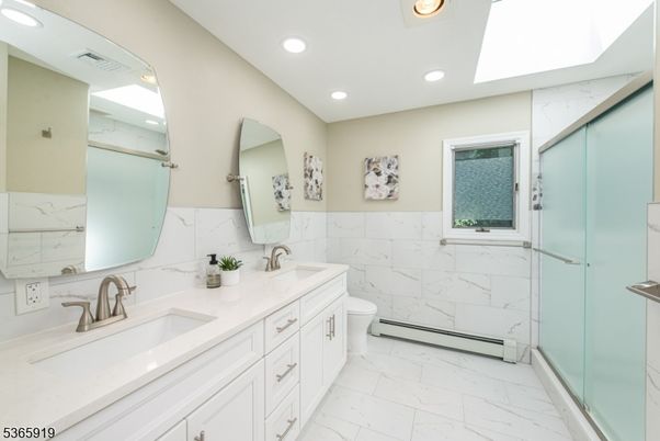 Bathroom, Dual Sink Vanities, Glass Shower, Interior, Marble, Marble Walls, Recessed Lighting