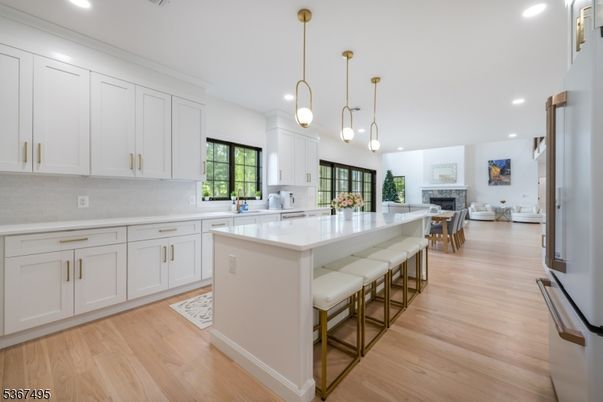 Dining room, Fireplace, Interior, Kitchen, Living room, Pendant Lights, Recessed Lighting, Wood Texture Flooring