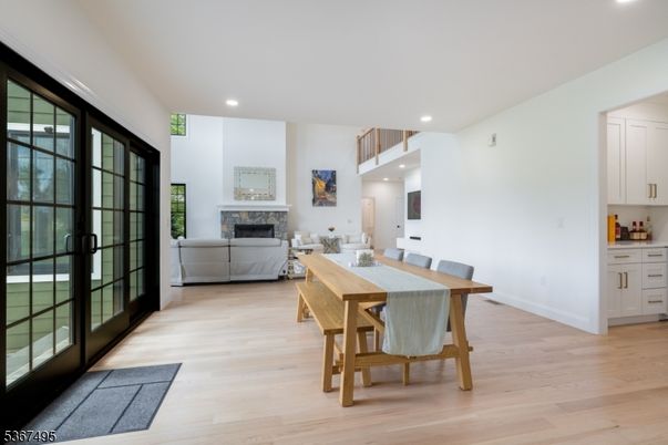 Dining room, Fireplace, Interior, Living room, Recessed Lighting, Wood Texture Flooring