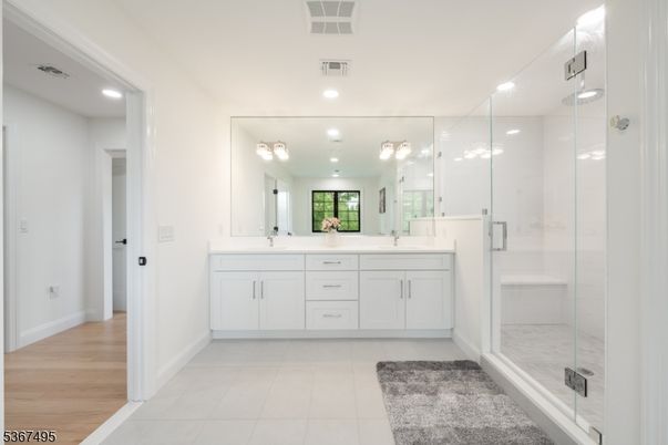 Bathroom, Dual Sink Vanities, Glass Shower, Interior, Recessed Lighting, Wood Texture Flooring