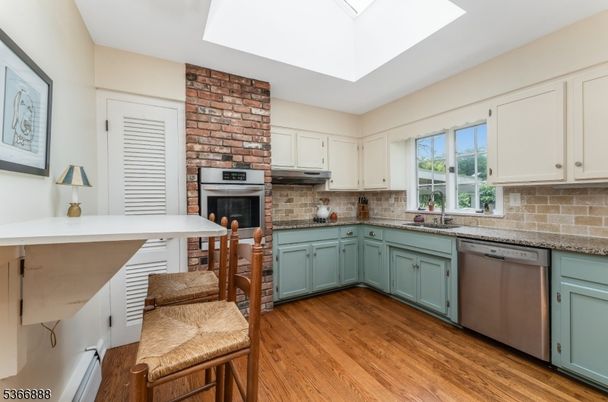 Fireplace, Interior, Kitchen, Stainless Steel Appliances, Stone Walls, Wood Texture Flooring