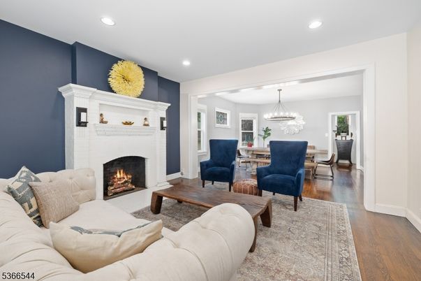 Chandelier, Dining room, Fireplace, Interior, Living room, Recessed Lighting, Wood Texture Flooring