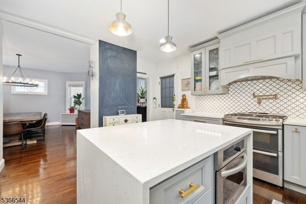 Dining room, Interior, Kitchen, Pendant Lights, Stainless Steel Appliances, Wood Texture Flooring