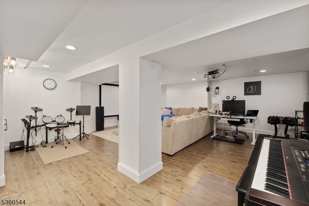 Fitness Equipment, Home Office, Interior, Living room, Piano, Recessed Lighting, Wood Texture Flooring
