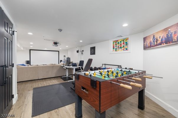 Game Room, Interior, Living room, Projection Screen, Recessed Lighting, Wood Texture Flooring
