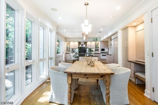 Dining room, Interior, Kitchen, Pendant Lights, Recessed Lighting, Stainless Steel Appliances, Wood Texture Flooring