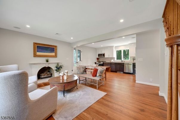 Fireplace, Interior, Kitchen, Living room, Recessed Lighting, Stainless Steel Appliances, Wood Texture Flooring