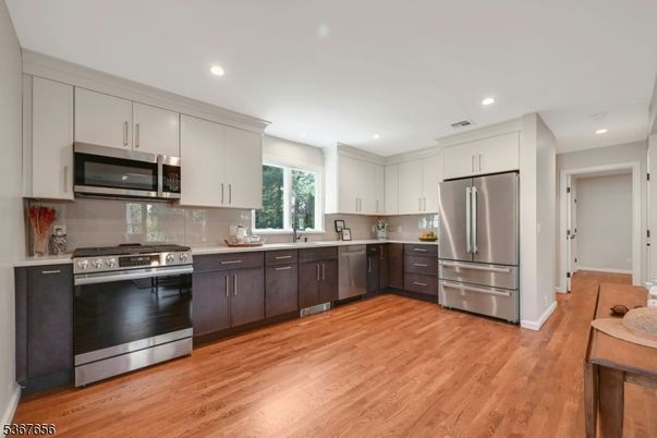 Interior, Kitchen, Recessed Lighting, Stainless Steel Appliances, Wood Texture Flooring