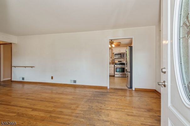 Empty room, Interior, Kitchen, Stainless Steel Appliances, Wood Texture Flooring