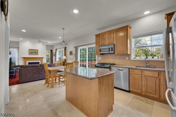 Dining room, Fireplace, Interior, Kitchen, Living room, Pendant Lights, Recessed Lighting, Stainless Steel Appliances
