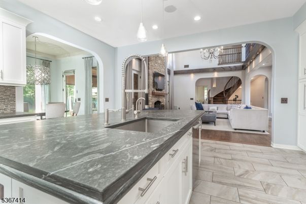 Chandelier, Fireplace, Interior, Living room, Pendant Lights, Recessed Lighting, Wood Texture Flooring