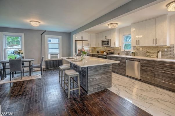 Chandelier, Dining room, Interior, Kitchen, Marble, Stainless Steel Appliances, Wood Texture Flooring