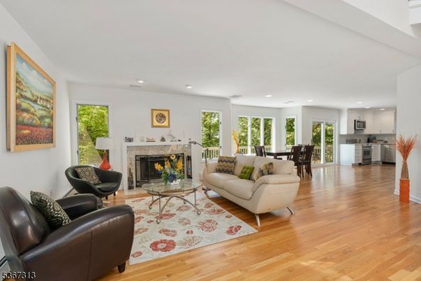Dining room, Fireplace, Interior, Kitchen, Living room, Recessed Lighting, Wood Texture Flooring